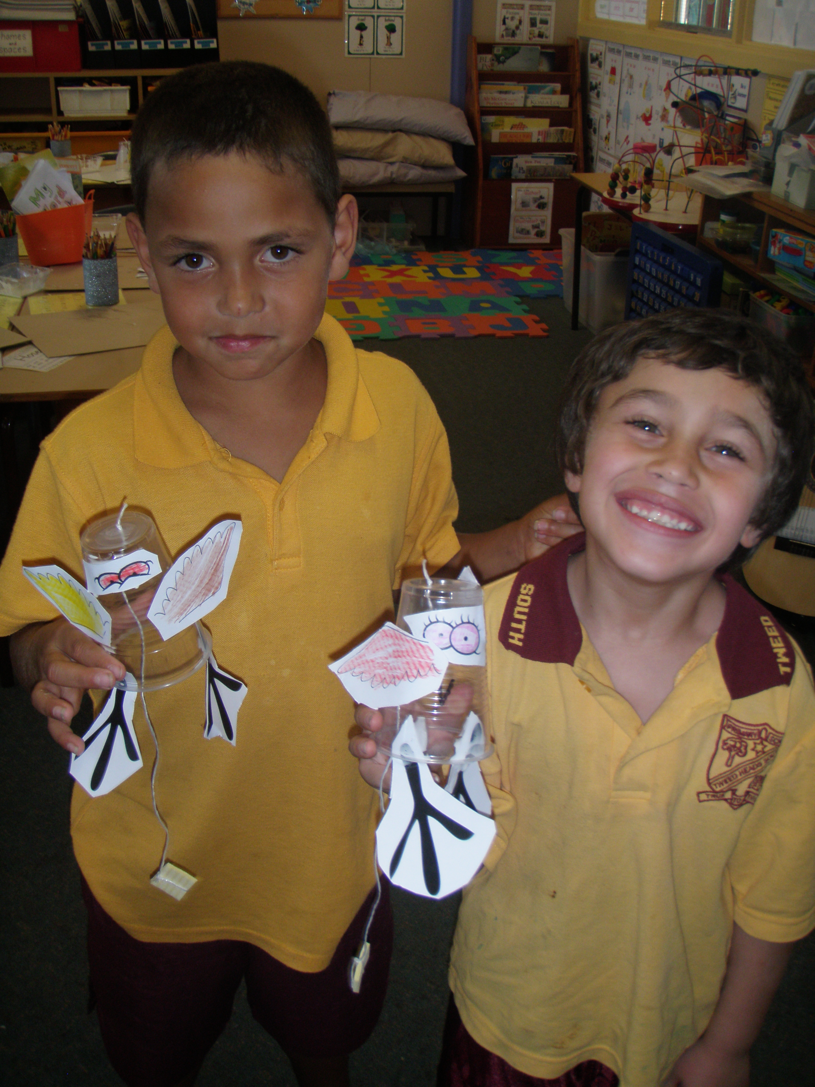Quade and Hosea with their plastic cup chickens 