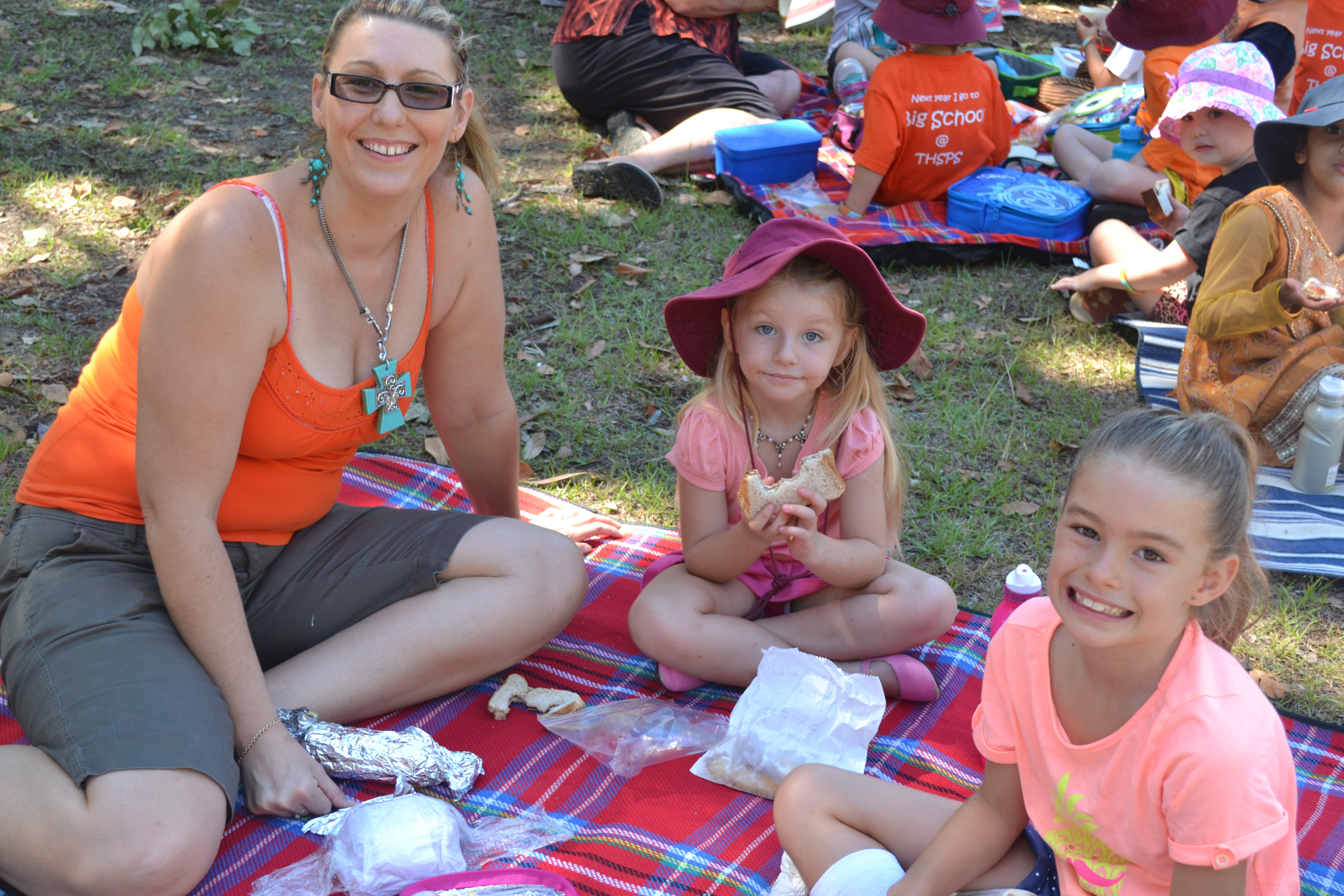 Aurelie with her mum and sister enjoying a picnic lunch together